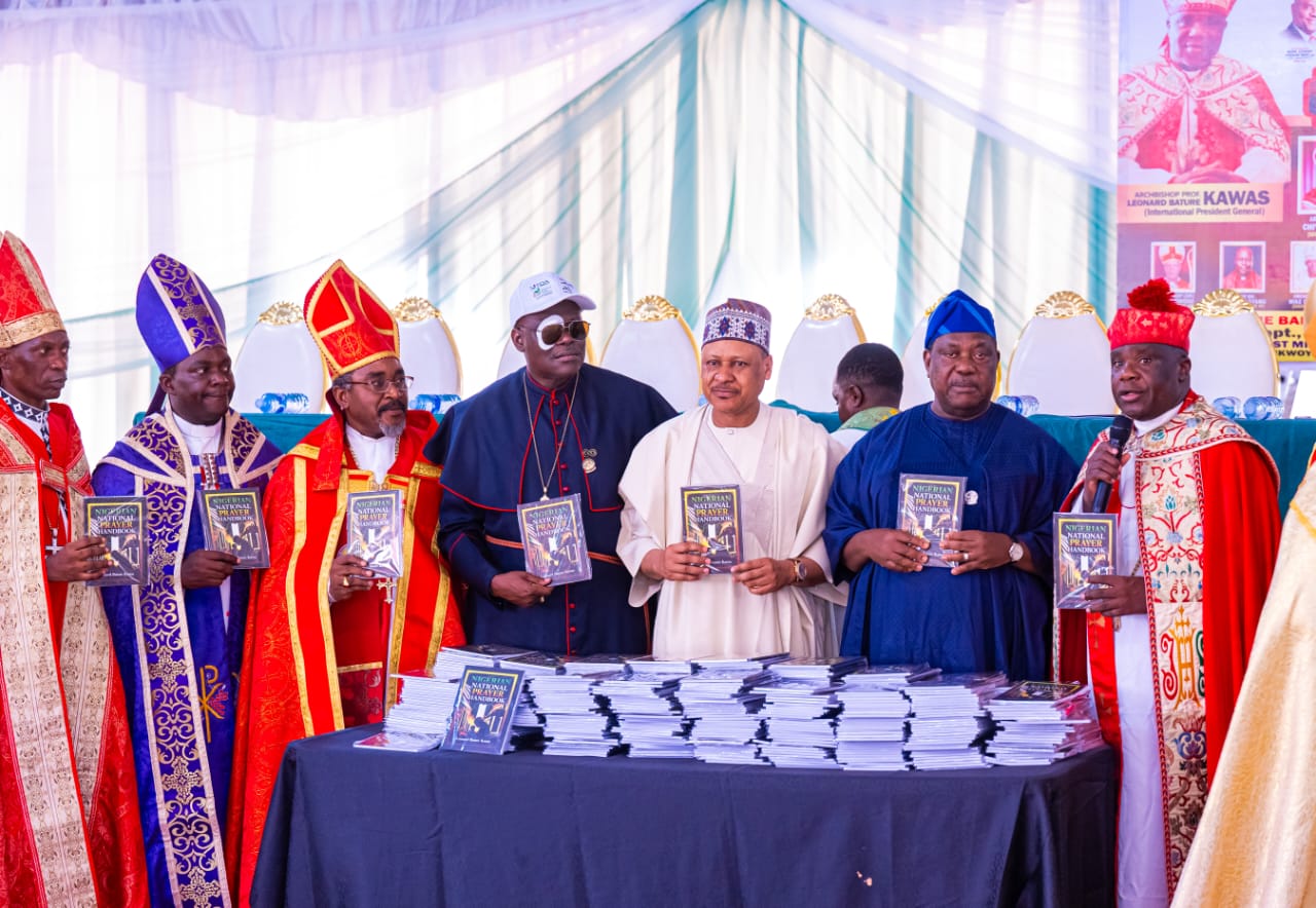 (R–L): President-General, Charismatic Bishops Conference of Nigeria, Archbishop Leonard Bature Kawas; representative of the President and Commander-in-Chief of the Armed Forces and the Secretary to the Government of the Federation, Senator George Akume; Minister of Information and National Orientation, Mohammed Idris; representative of the First Lady of the Federal Republic of Nigeria; and National Chairman, Lagos State CAN, Bishop (Dr.) Stephen Adegbite, during the unveiling of the book Nigerian National Prayer Handbook, authored by Archbishop, Prof. Leonard Bature Kawas, at the Grand Finale of the 2026 Synod of the Charismatic Bishops Conference of Nigeria, on September 9, 2026, in Abuja.Photo: Khalid Ahmed/FMINO