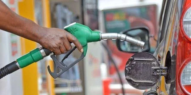 Petrol pump dispensing fuel at a feeling station