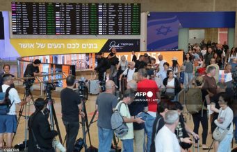 Dubai-Tel Aviv Flight Makes Emergency Landing as Pilots Fight in Cockpit Media representatives gather along with passengers at the Ben Gurion Airport near Tel Aviv on September 30, 2026. A flydubai plane bound for Tel Aviv was forced to land in Saudi Arabia on September 30 after an "incident", the airline said, with Israeli media reporting an altercation between the pilots. (Photo by Jack GUEZ / AFP)