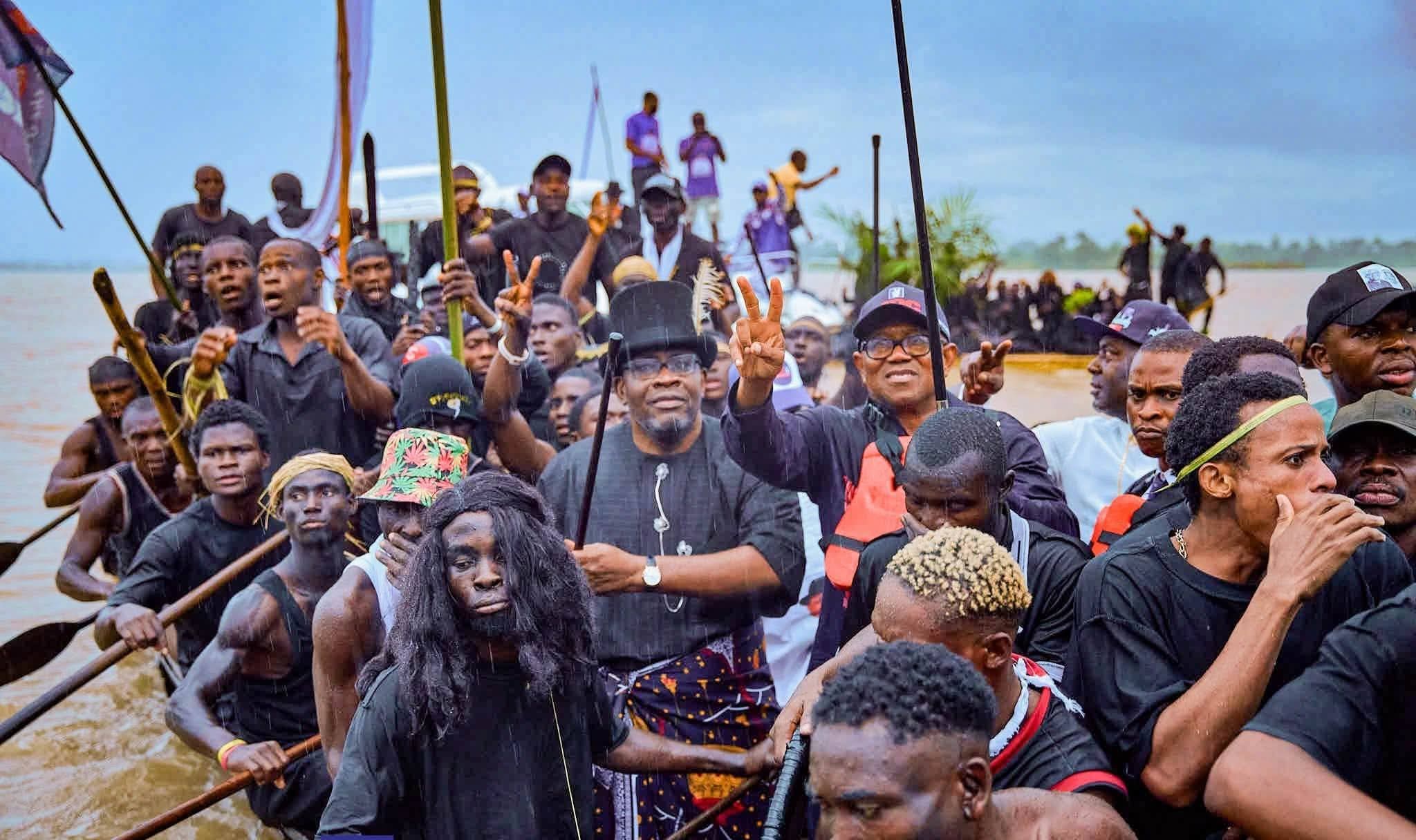 Senator Henry Seriake Dickson and the presidential candidate of the Nigeria Democratic Congress (NDC), Peter Obi, at the traditional boat regatta at Toru-Orua community in Sagbama Local Government Area on Friday 