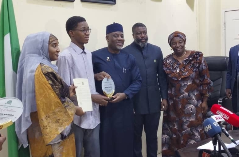 Minister of Education, Tunji Alausa and Registrar of the Joint Admissions and Matriculation Board (JAMB), Professor Segun Aina, in a group photograph with other stakeholders on Wednesday